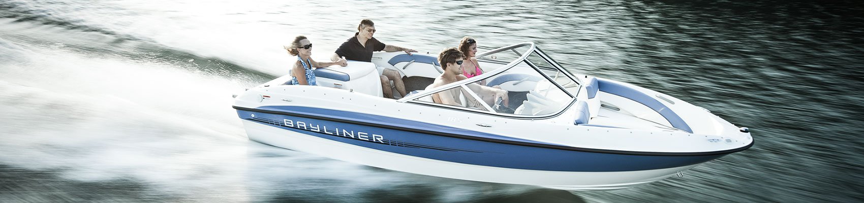 Family enjoying a thrilling ride on a boat equipped with Mercury sterndrive engines